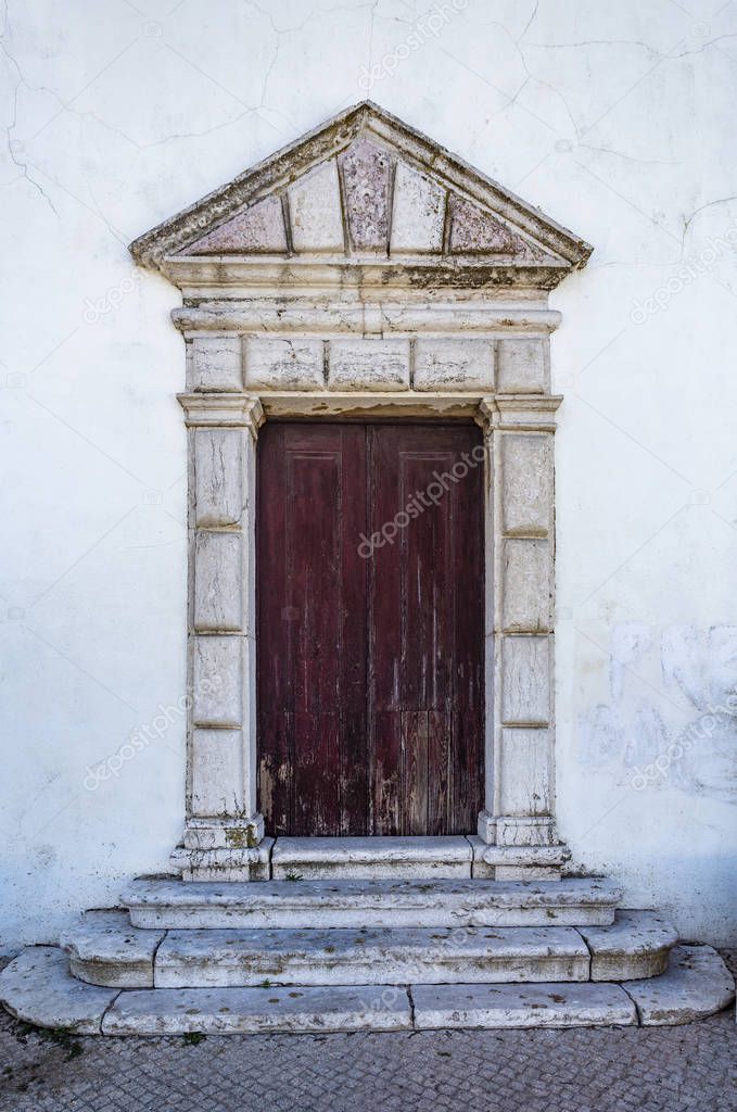 Entrance door of the late Renaissance Church of Our Lady of Life, built in 16th century in the village of Alcochete, Lisbon, Portugal