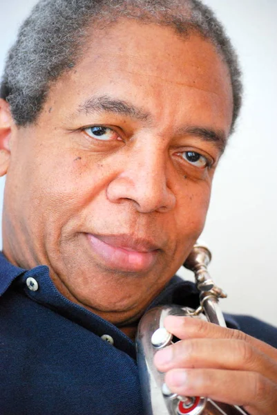 African American Jazz Musician Blowing His Flugelhorn Indoors — Stock Photo, Image