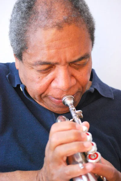 African American Jazz Musician Blowing His Flugelhorn Indoors — Stock Photo, Image