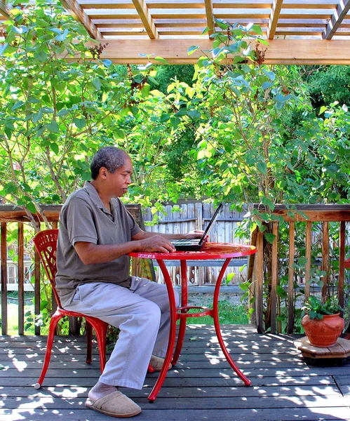 African American Male Working His Laptop Patio Deck Outdoors — Stock Photo, Image