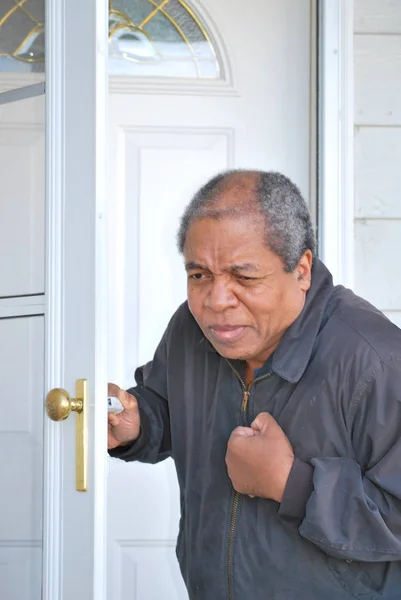 African American Male Having Chest Pains Leaves His House Work — Stockfoto
