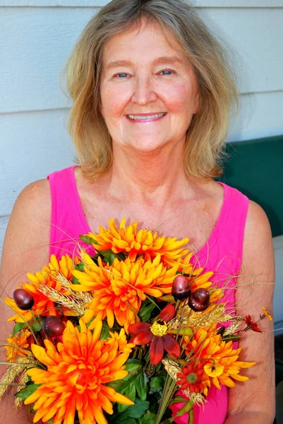 Mature Female Senior Beauty Expressions Holding Flowers Outdoors — Stock Photo, Image