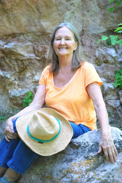 Mature Female Senior Expressions Sitting Rocks Outdoors — Stock Photo, Image