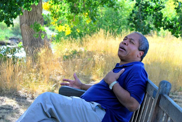 African American Male Having Chest Pains Outdoors — Stock Photo, Image