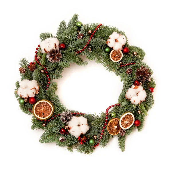 Christmas wreath with red shiny beads with flowers of cotton and — Stock Photo, Image