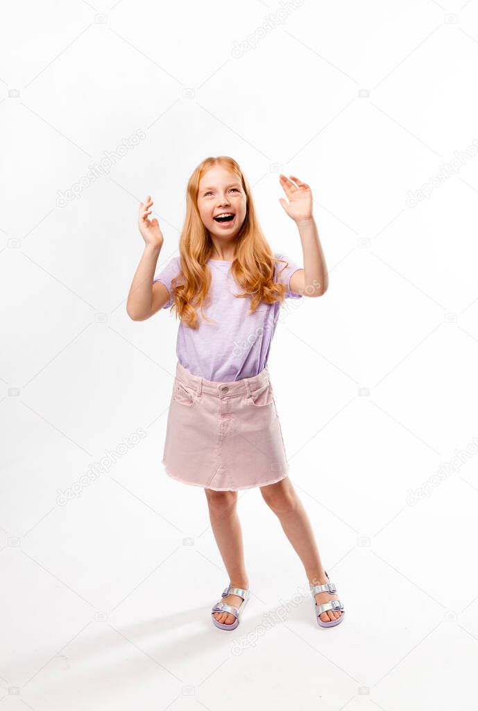 cute red-haired girl gestures and laughs