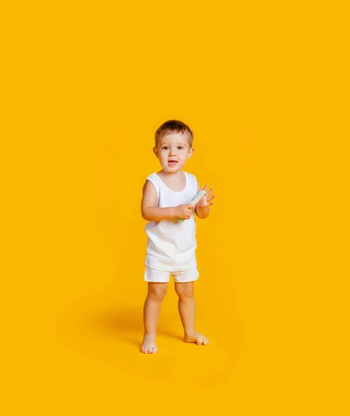 Boy Standing White Shirt Underpants Comb His Hands Orange Yellow — Stock Photo, Image