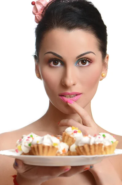 Girl taking colorful cakes — Stock Photo, Image