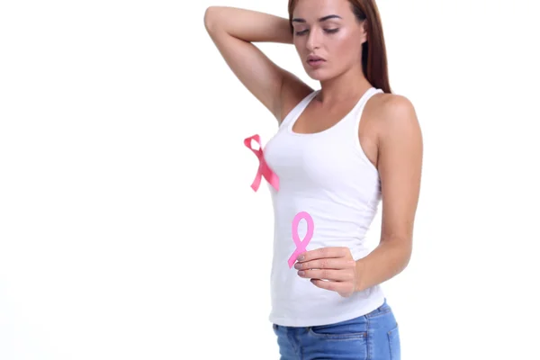 Womans hand holding pink breast cancer awareness ribbon — Stock Photo, Image