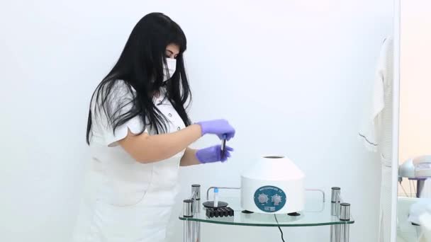 Esearcher performs blood centrifuging — Stock Video