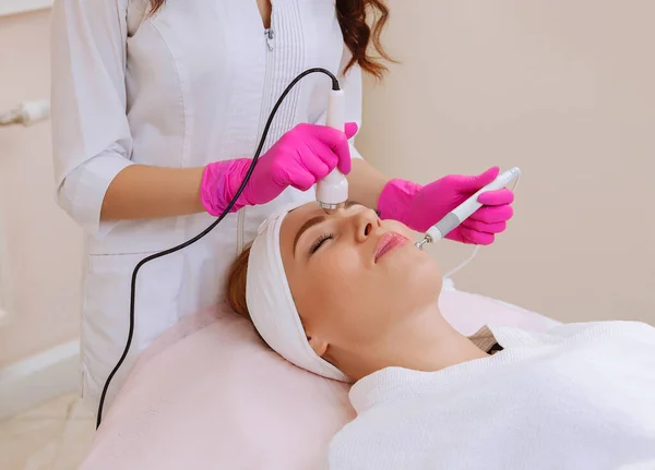 Ultrasound cavitation procedure. Anti-aging, lifting procedure. Stock Photo