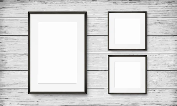 Set of black frames on wooden background — Stock Vector