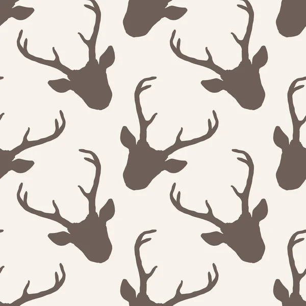 Seamless pattern with deer heads silhouettes — Stock Vector