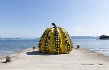 NAOSHIMA, JAPAN. JUNE 6: Yayoi Kusama's giant pumpkin sculpture  clipart