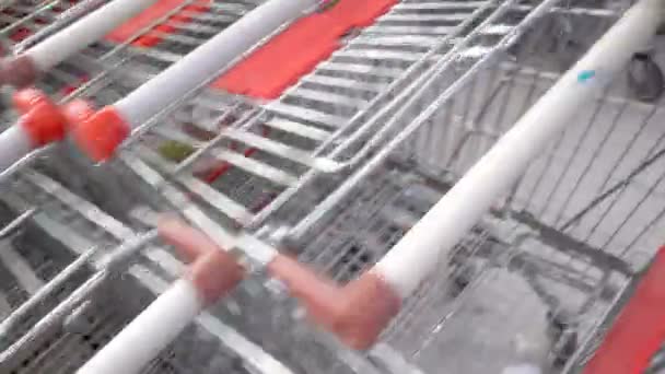 Shopping carts on a parking lot — Stock Video