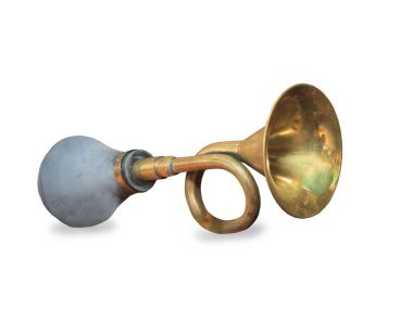 Vintage car horn or klaxon isolated on white background clipart