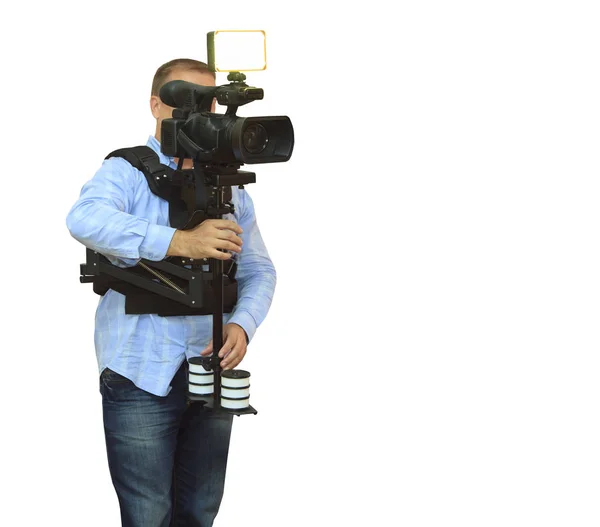Operator kamery wideo pracujący ze swoim profesjonalnym sprzętem — Zdjęcie stockowe
