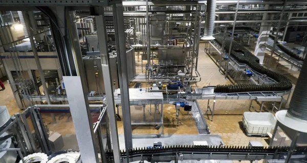 Modern conveyor for water bottling machine — Stock Photo, Image