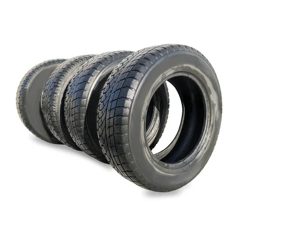 Stack of four wheel new black winter tyres for car — Stock Photo, Image