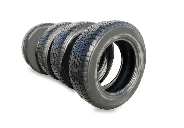 Stack of four wheel new black winter tyres for car — Stock Photo, Image