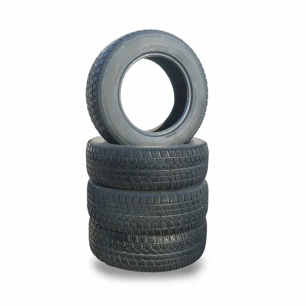Pila de cuatro ruedas nuevos neumáticos de invierno negro para coche —  Fotos de Stock