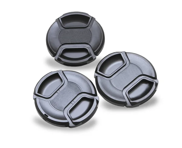 Three lens caps for digital camera isolated over white — Stock Photo, Image