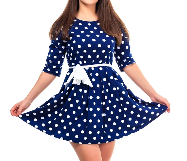 Vrouw in een jurk met polka dot print, geïsoleerd op witte backgro — Stockfoto