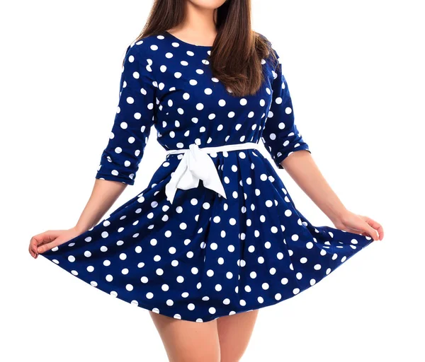Vrouw in een jurk met polka dot print, geïsoleerd op witte backgro — Stockfoto