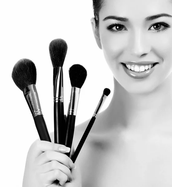 Donna con spazzole cosmetiche — Foto Stock