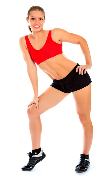 Fitness donna posa su uno sfondo bianco, isolato — Foto Stock