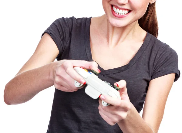 Joven mujer juega un videojuego, aislado en blanco —  Fotos de Stock