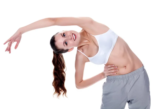 Frau macht Stretching, isoliert auf weißem Hintergrund — Stockfoto