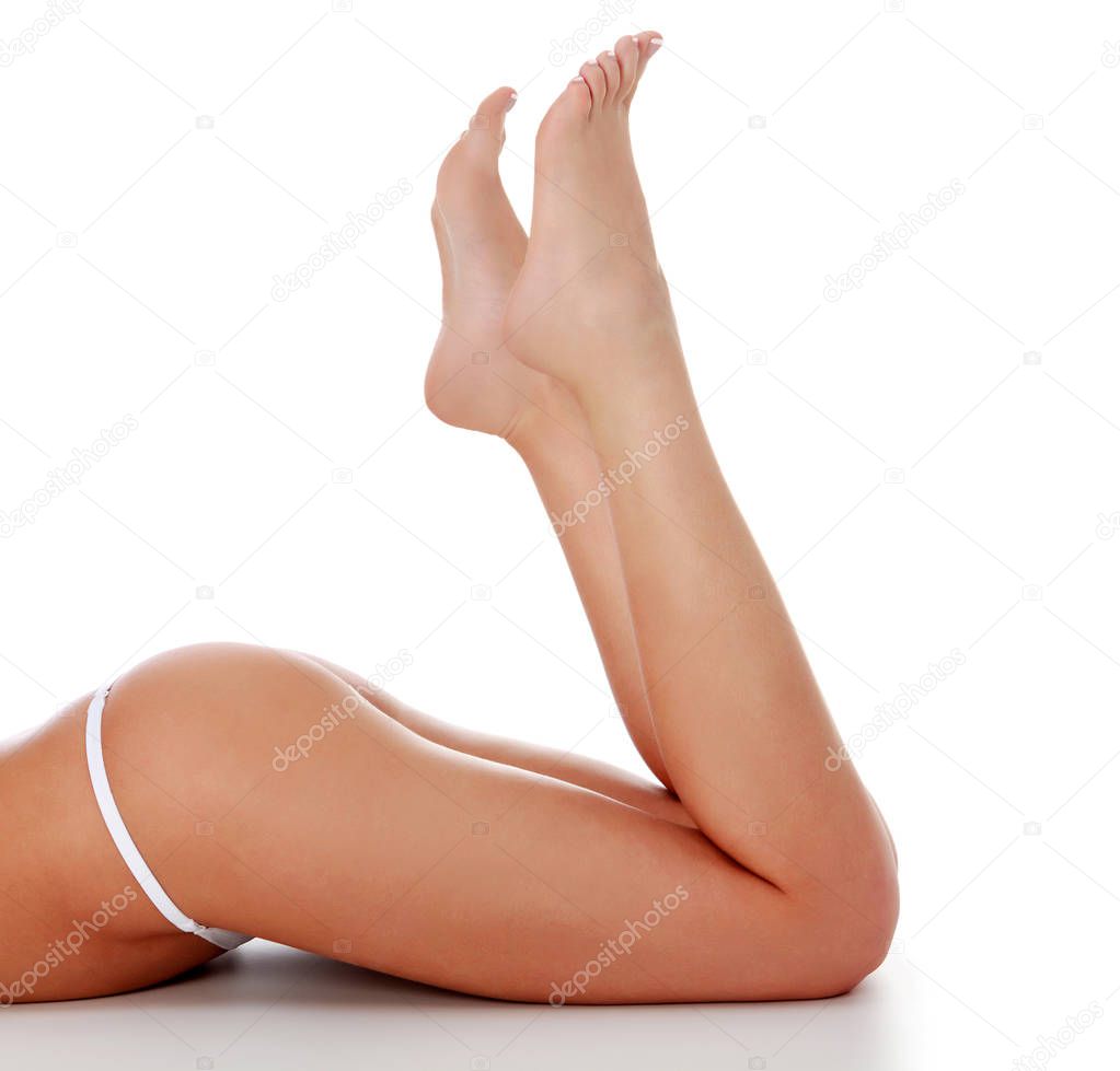 Woman's legs on white background, isolated