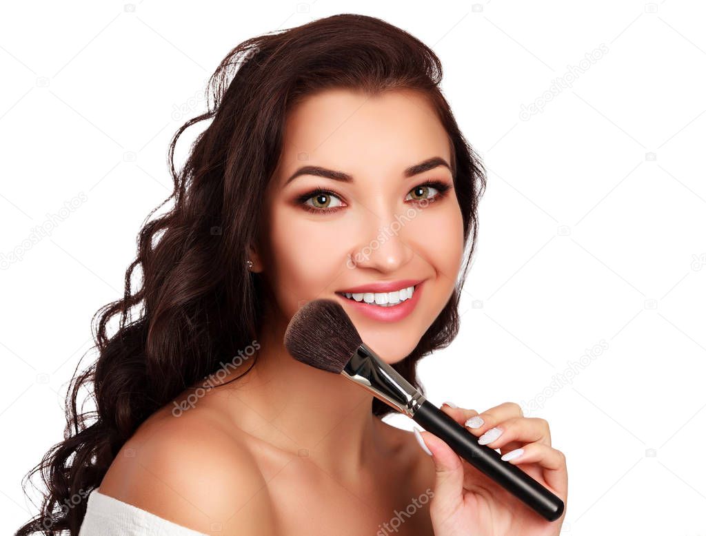 Beautiful girl with make-up brush.