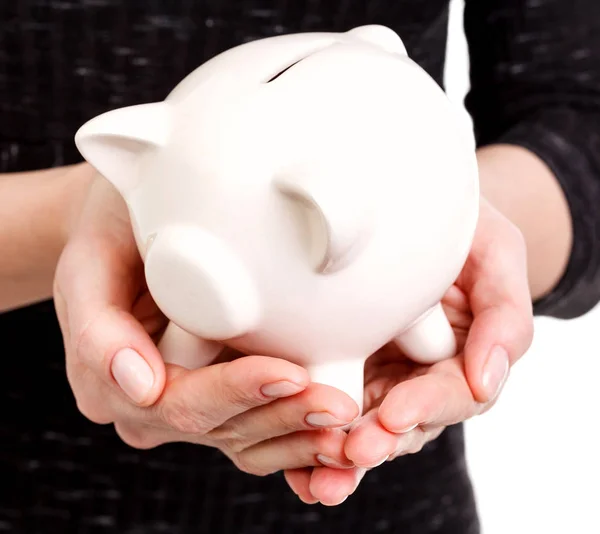 Closeup shot of woman's hands holding a piggy bank — Stock Photo, Image