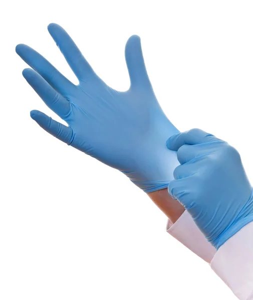 在蓝色的乳胶手套，孤立的白色背景上的军医手的特写镜头 — 图库照片