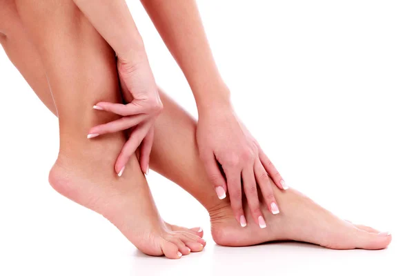 Woman's legs and hands, white background, isolated — Stock Photo, Image