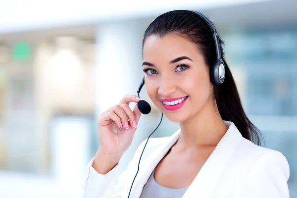 Closeup portrait of support phone operator in headset at workplace — Stock Photo, Image