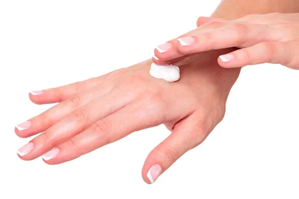 Primo piano colpo di belle mani di donna con crema, isolato su sfondo bianco — Foto Stock