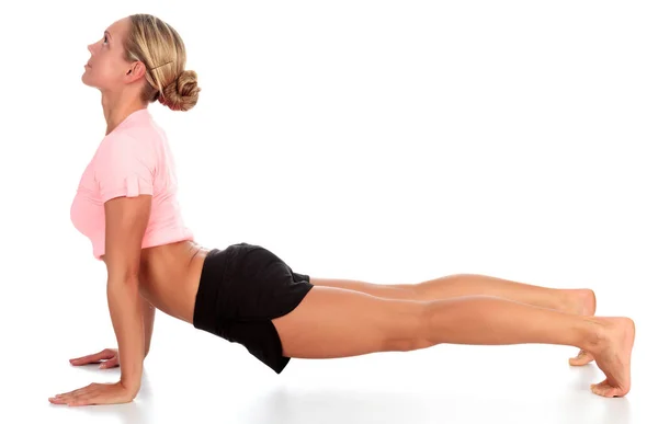 Žena, která dělá cvičení jógy, izolované na bílém pozadí — Stock fotografie