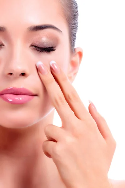 Closeup shot of young beauty woman massaging her face. Facial massage concept. Isolated on white background — Stock Photo, Image