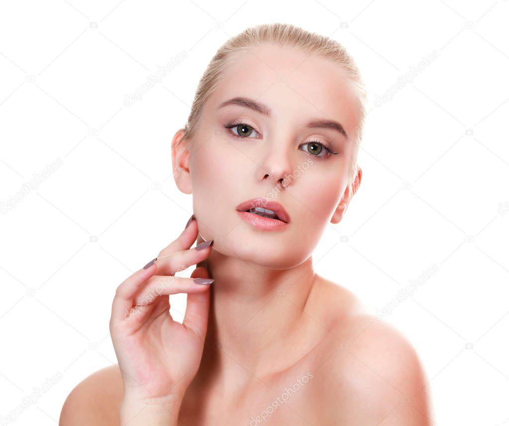 Closeup portrait of beautiful young female model, woman touching her face skin with manicured fingers, isolated on white background