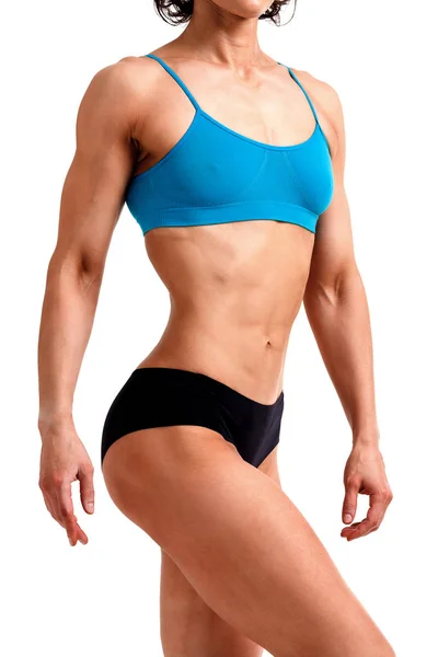Mulher fitness posando contra um fundo branco, isolado — Fotografia de Stock