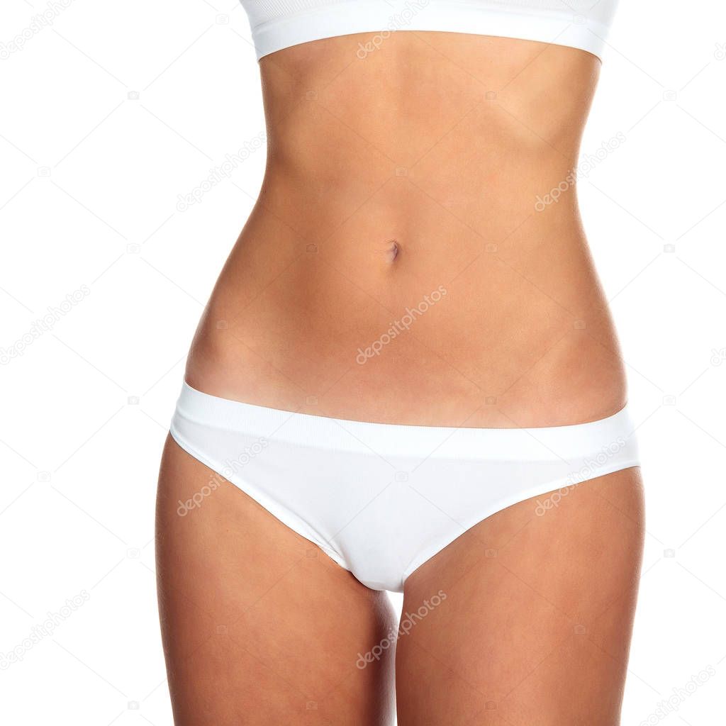 Closeup shot of slim female body against a white background, isolated