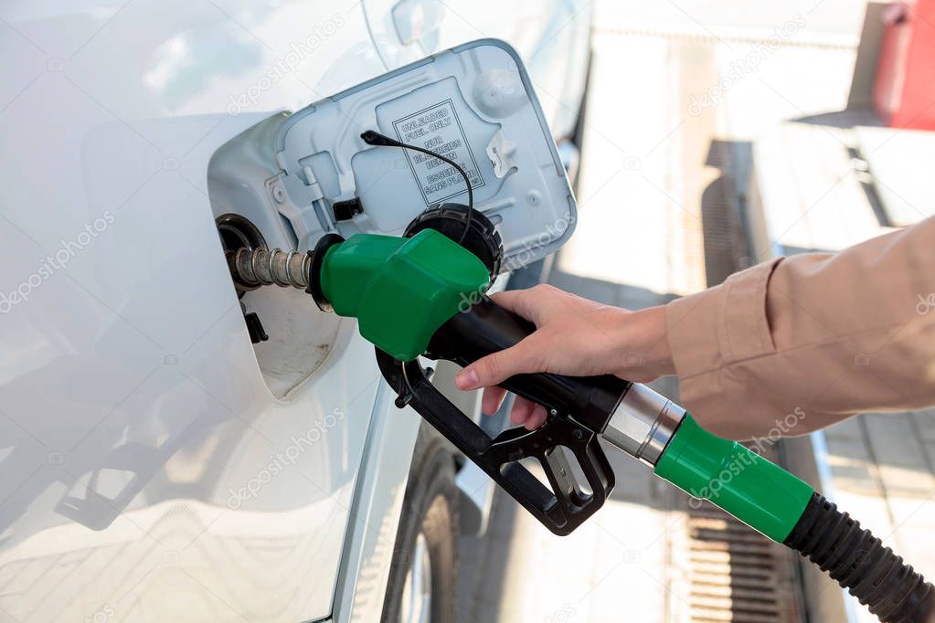 Woman at the gas pump station