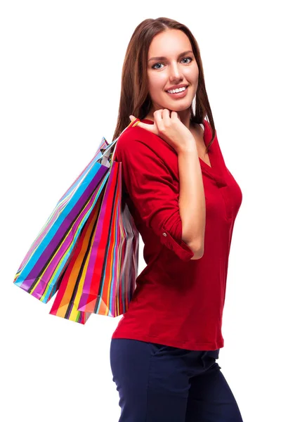 Portret młodej uśmiechniętej kobiety z torbami na zakupy, odizolowany na białym tle — Zdjęcie stockowe