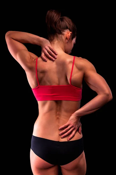 Bodybuilder Woman Suffers Pain Her Back Neck Workout Black Background — Stock Photo, Image