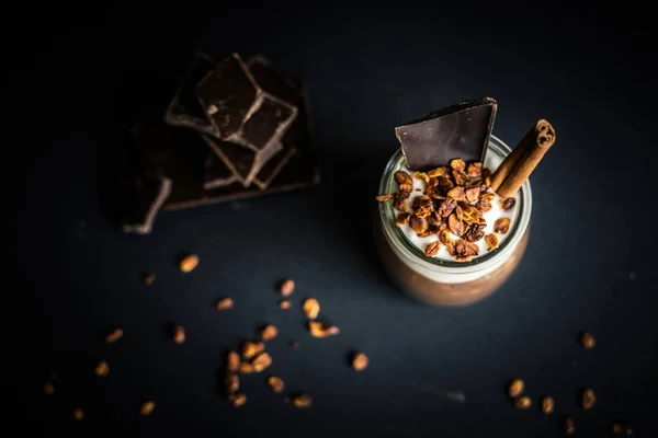 Cup of hot chocolate with chocolate bars and granola — Stock Photo, Image