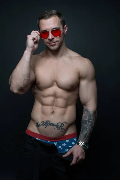 Bodybuilder with sunglasses