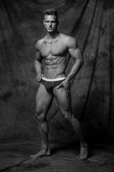 Fitness male model in studio